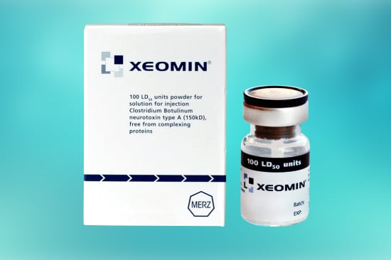 Image of a product named XEOMIN. The product box is displayed on the left, featuring the brand name and dosage information. To the right of the box, there is a small glass vial labeled XEOMIN containing 100 LD50 units. The background is a gradient of blue tones. Buy Xeomin online for convenient access.