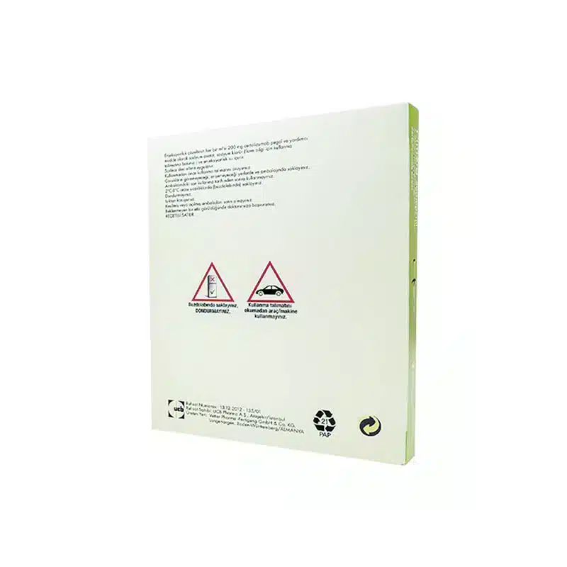 A white and green rectangular product packaging with printed text and safety warning symbols on the back. The text is small, and there are two triangular warning icons indicating caution and safety instructions. Recycling symbols are also visible at the bottom.