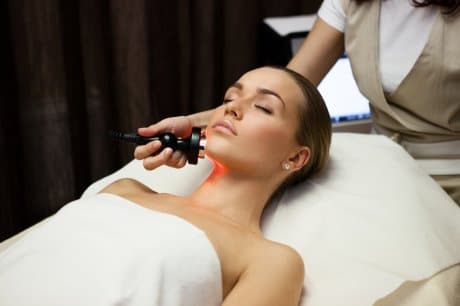 A young woman receives the medical spa procedure