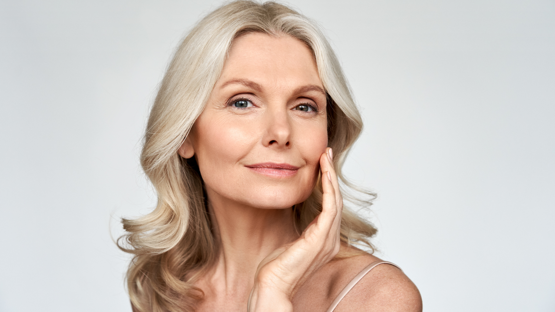 An older woman shows their smoother and healthier face.