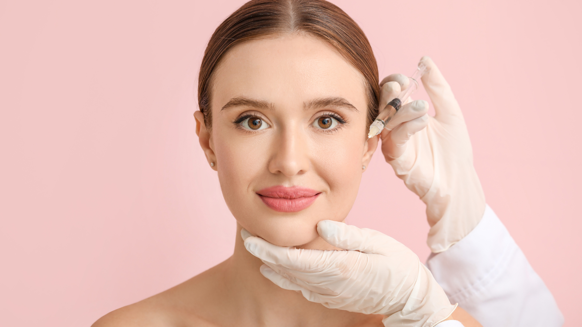 A medical practitioner injects a filler into the individual's facial skin.