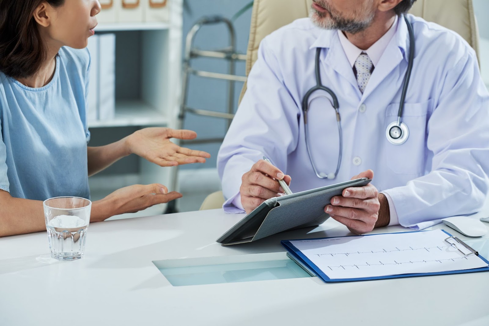 A medical professional and patient having a thorough consultation.