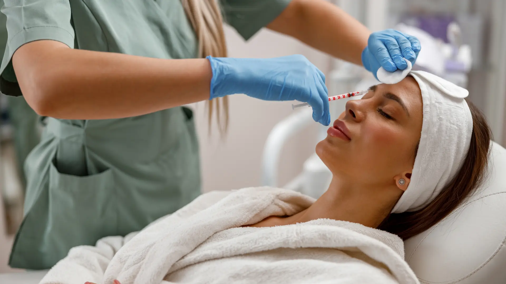 A medical professional administering a dermal filler injection.