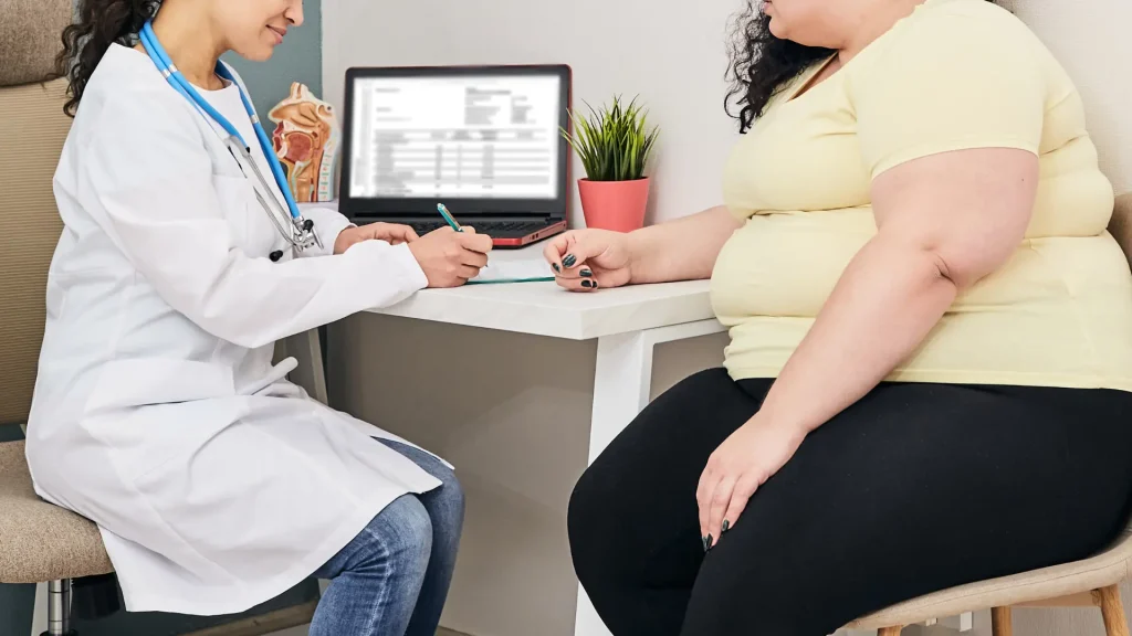 An individual getting a thorough consultation with a medical professional.