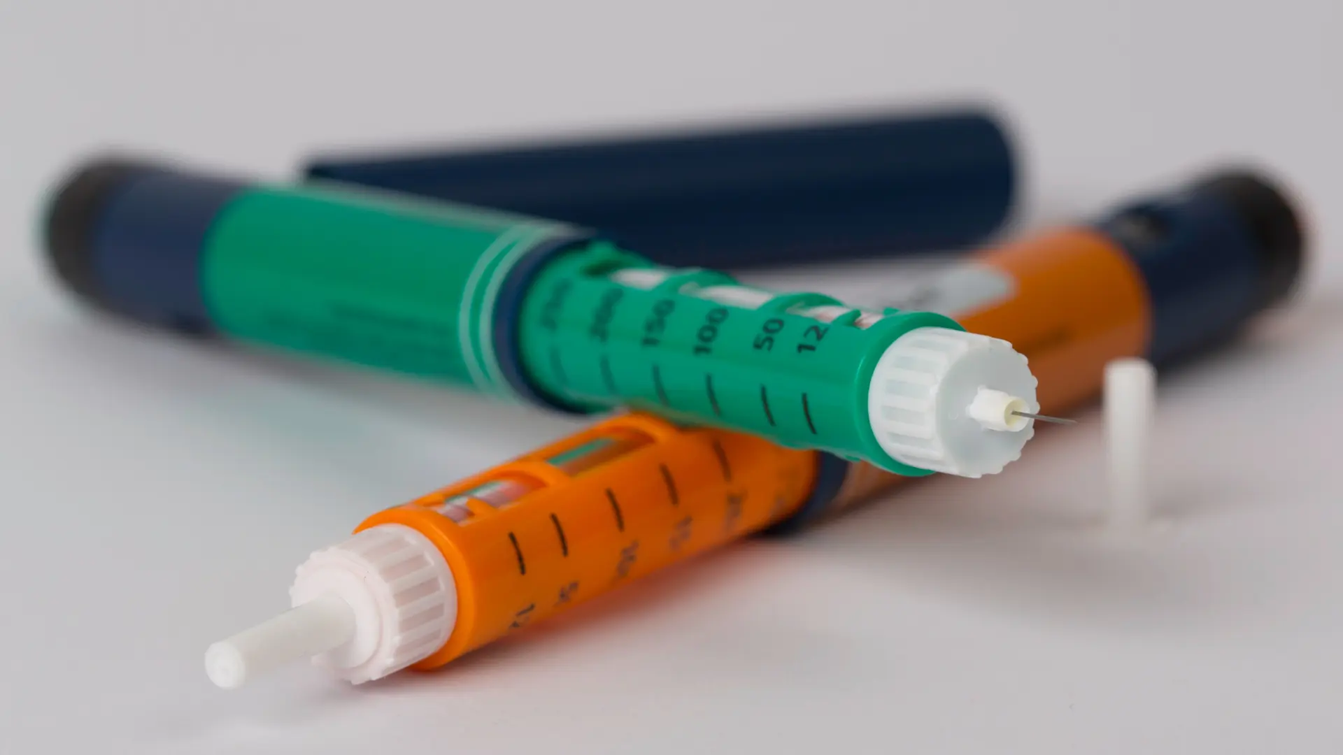 A close-up shot of two injectable pens.