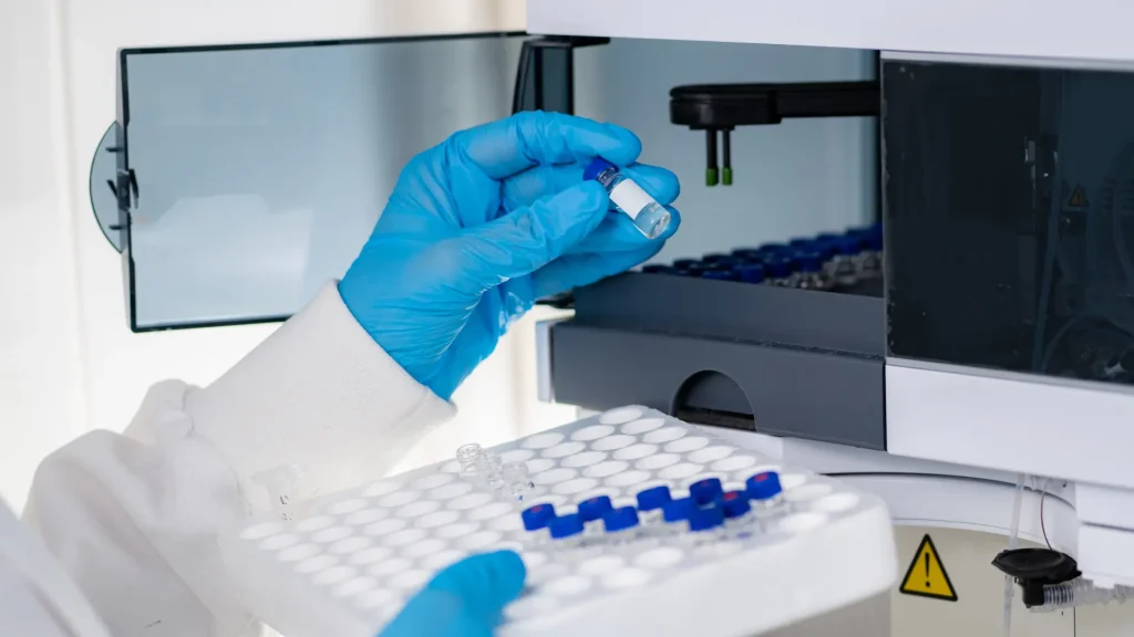 A medical expert working in a laboratory, examining the solutions' safety and efficacy.