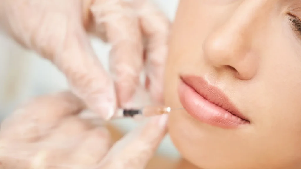 An individual receiving an injection into their lips.