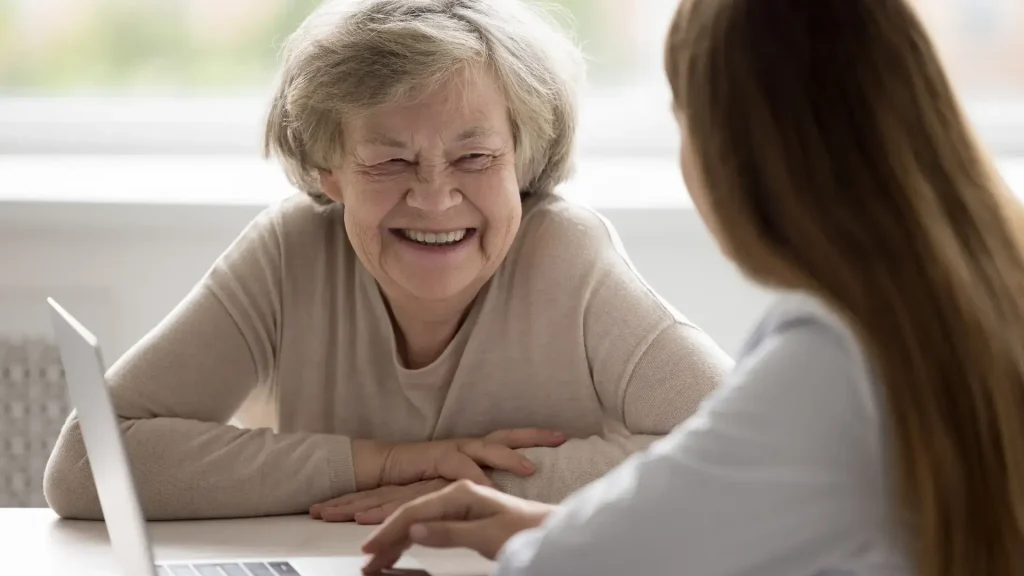 An older individual during a consultation with their aesthetic provider.