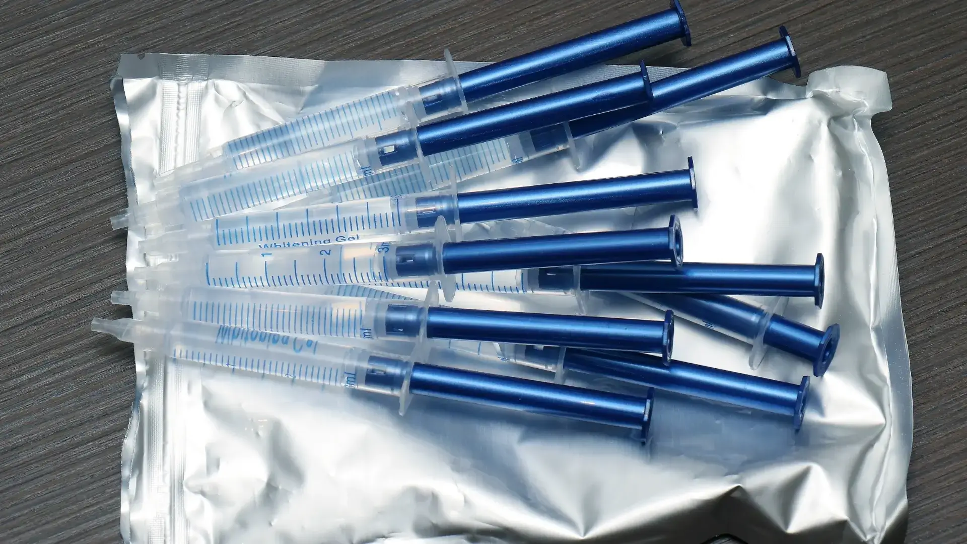 Various medical syringes before preparation.