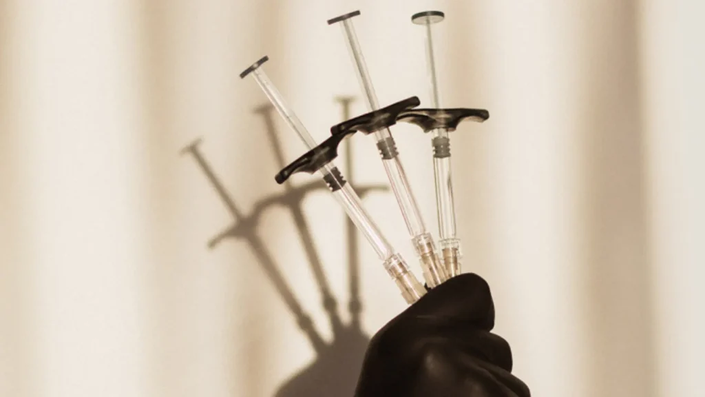 A provider holding Revanesse injections.