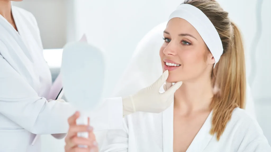 A medical professional assessing an individual's facial regions.
