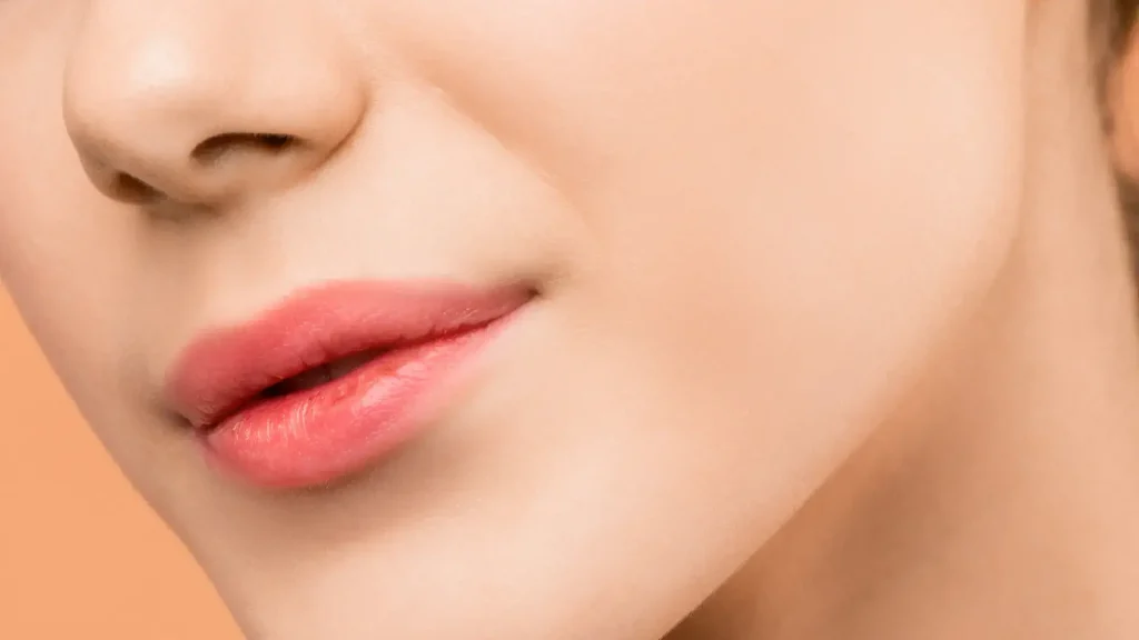 A patient flexing their jawline.