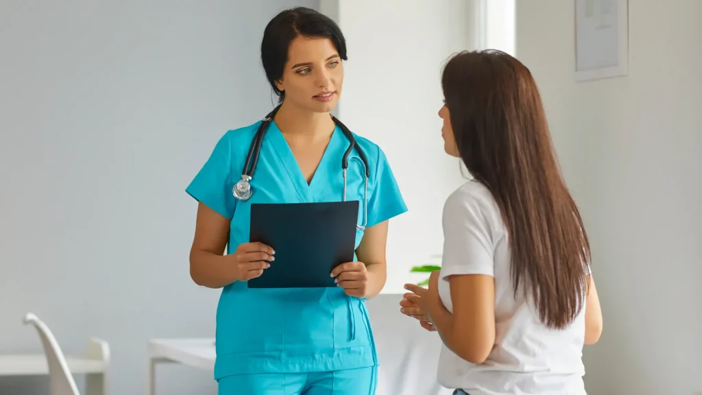 A medical professional and patient during a consultation.