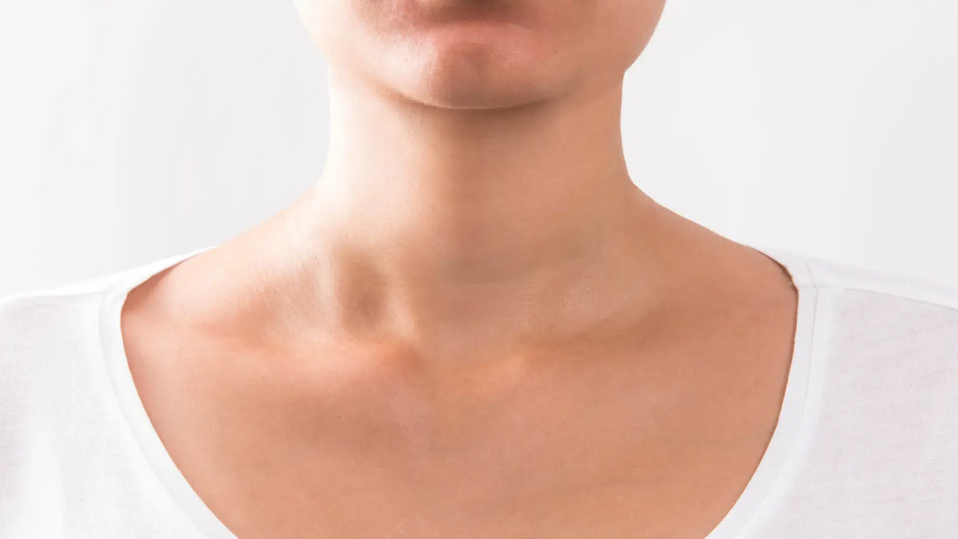A close-up shot of an individual's neck area.