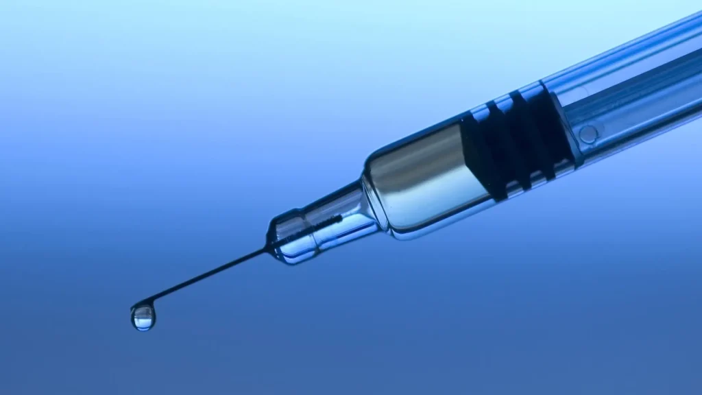 A close-up shot of a syringe needle tip.