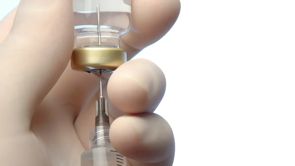 A medical professional preparing the injection.