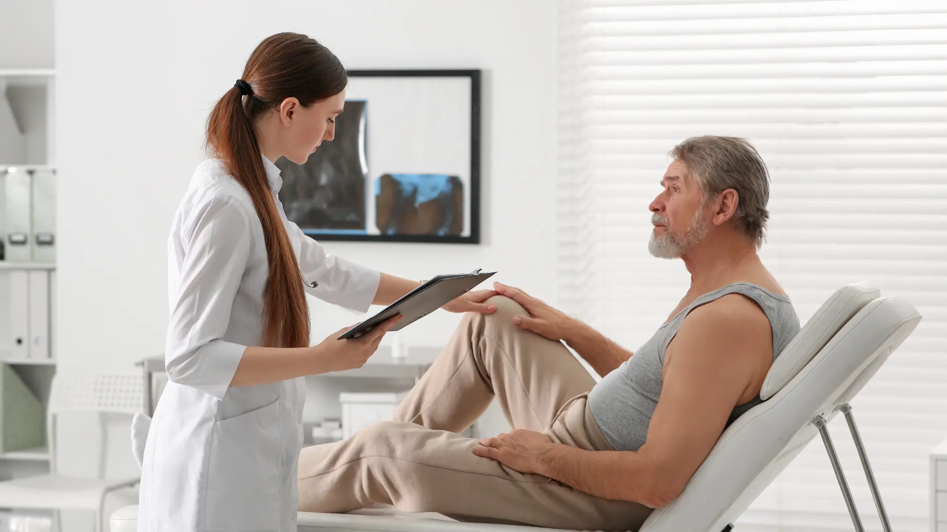 An individual receiving a consultation from a medical professional.