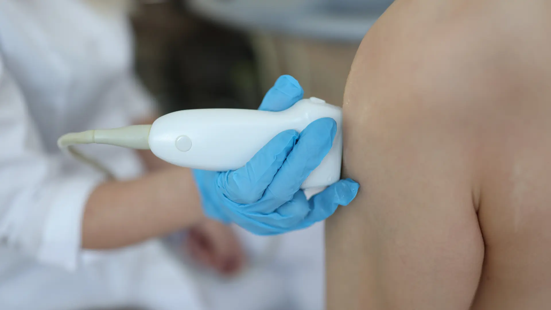 An individual getting their knee examined.