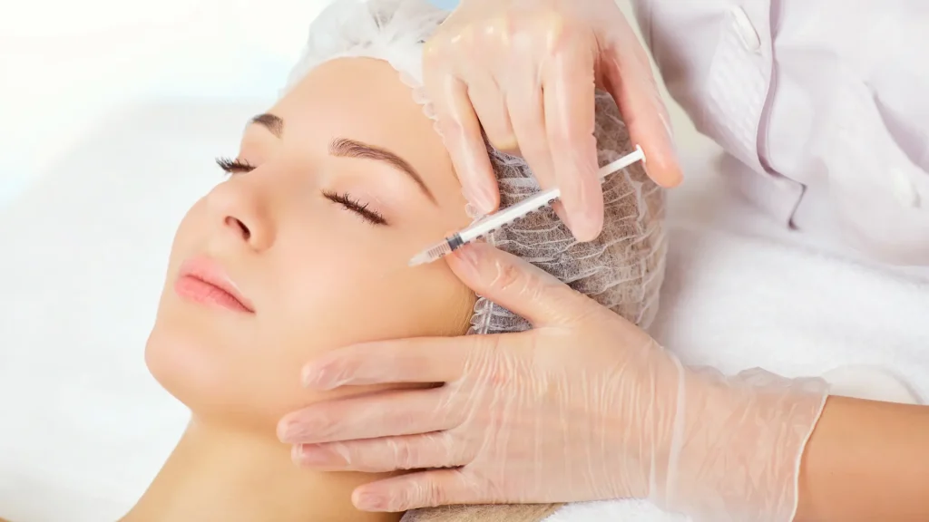 An individual receiving a facial injection.