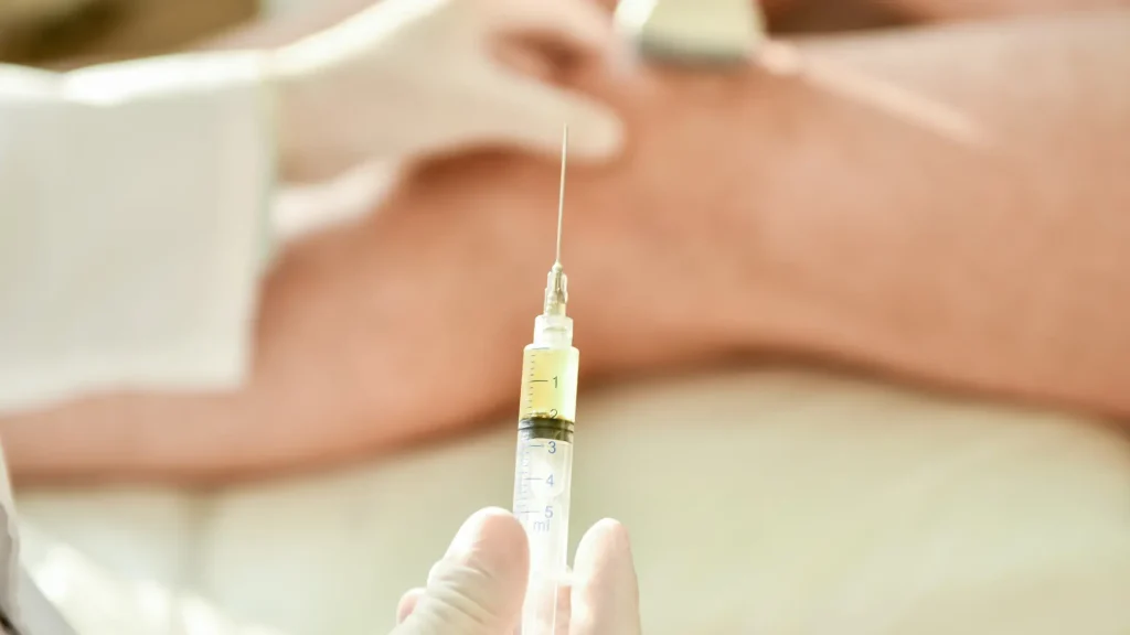 A close-up shot of an injection before administering into a patient's knee.