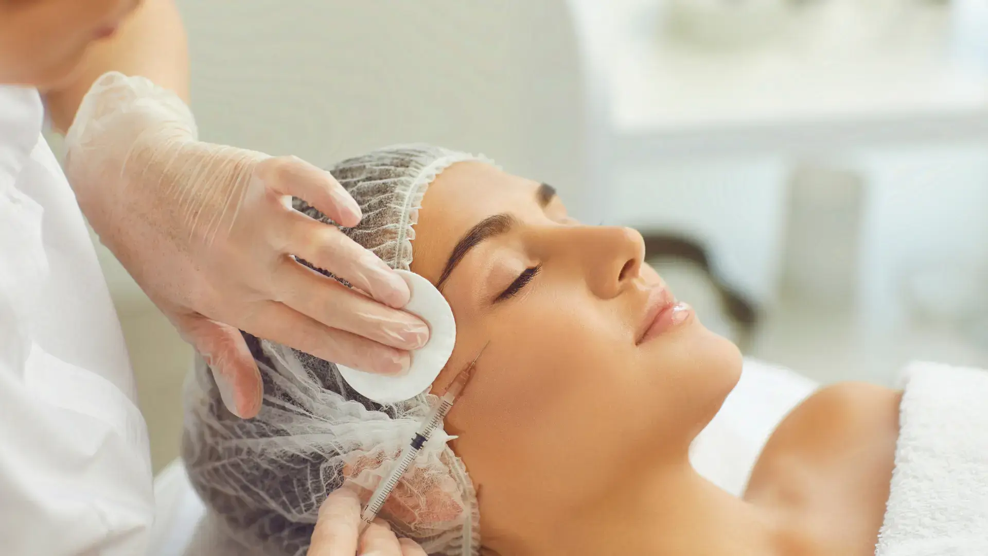 An individual receiving a facial injection for their aesthetic treatment.