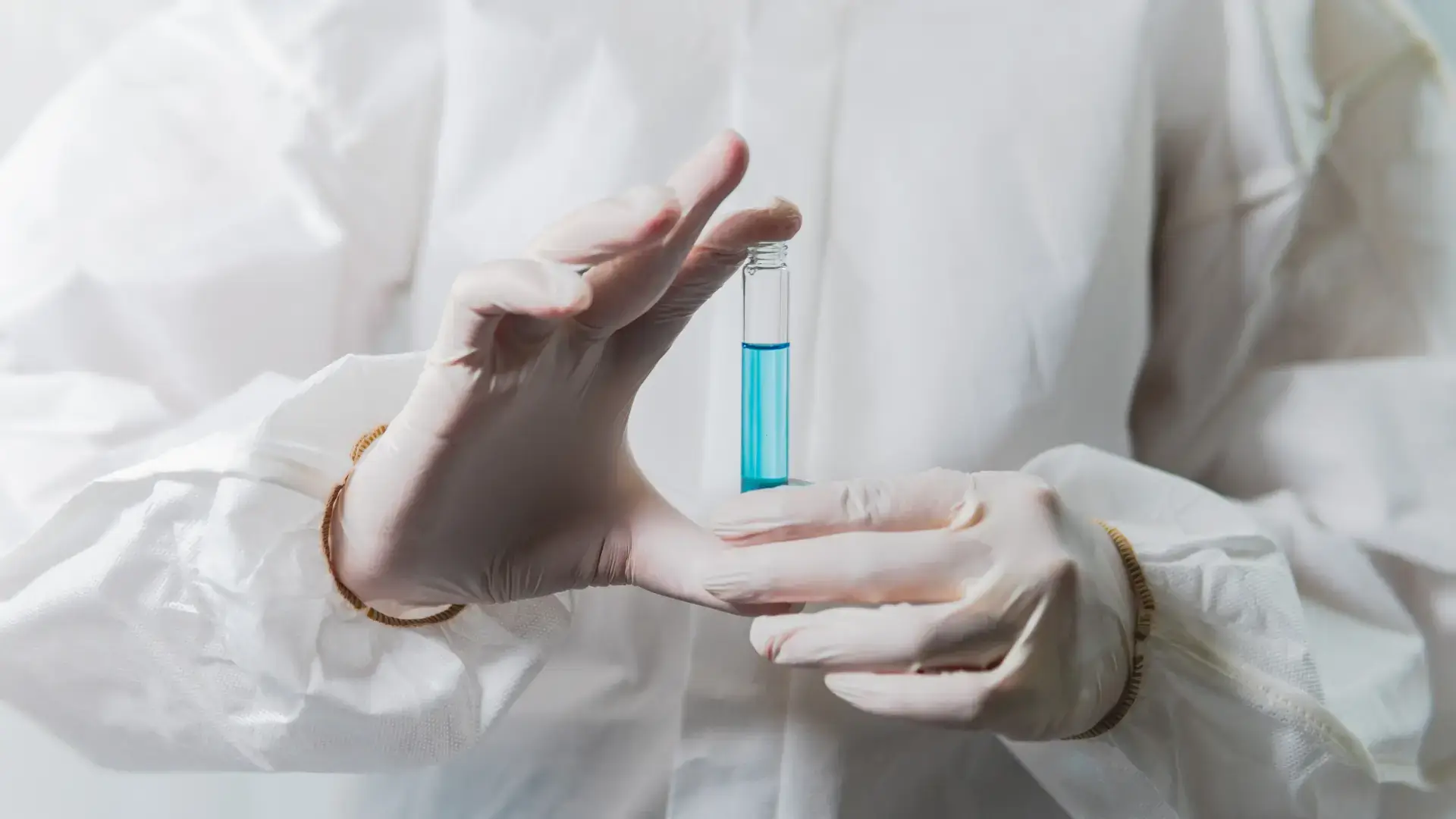 A medical expert holding an injection's solution.