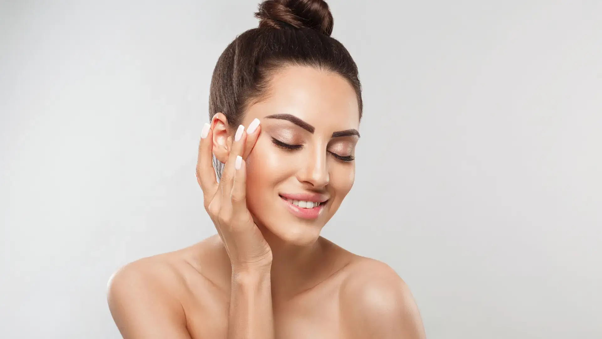 An individual showing off their firmer and smoother facial skin.