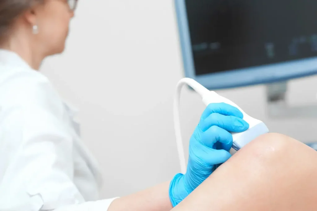 An individual undergoing a knee examination.