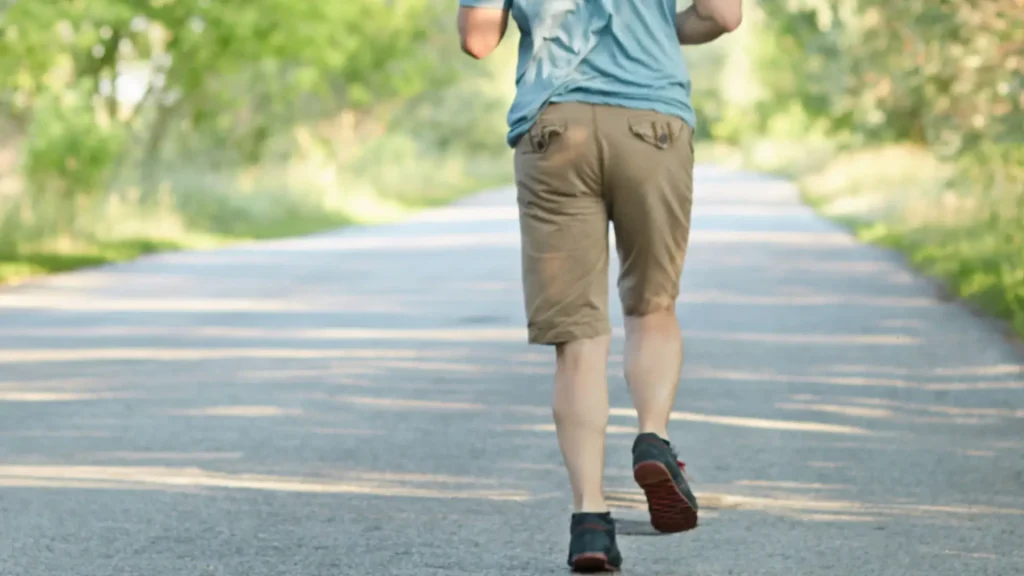 An individual jogging without feeling knee pain. 