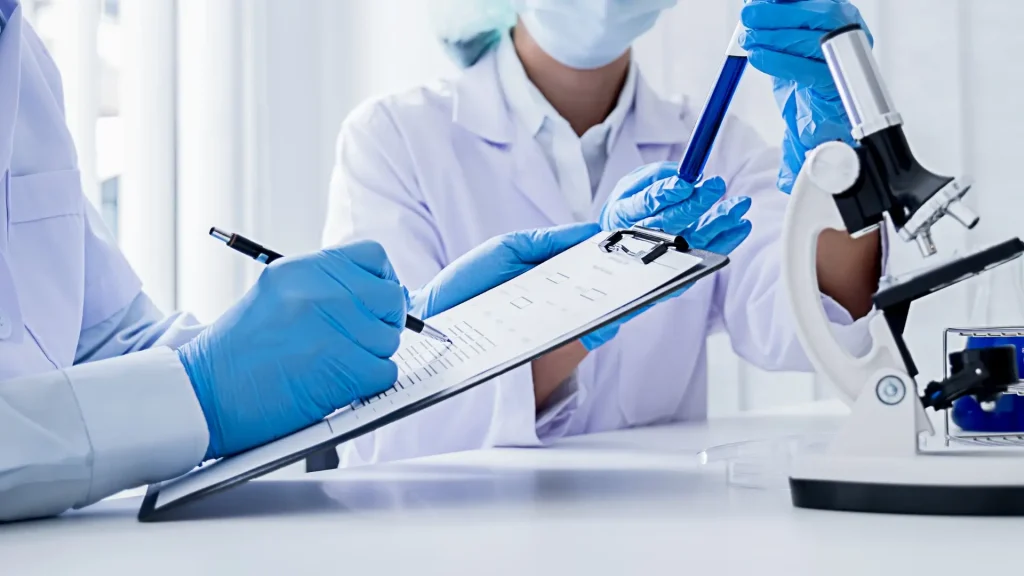 Two medical experts working in a clinical laboratory.