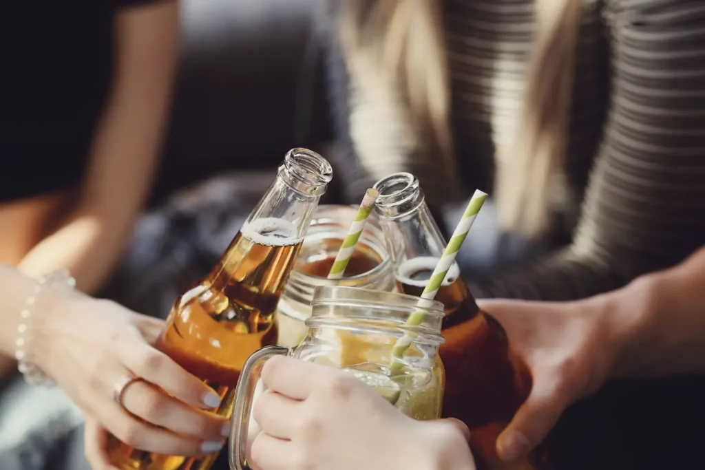 A group of individuals enjoying their alcohol drinks.