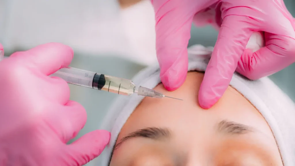 A close-up shot of a forehead injection.