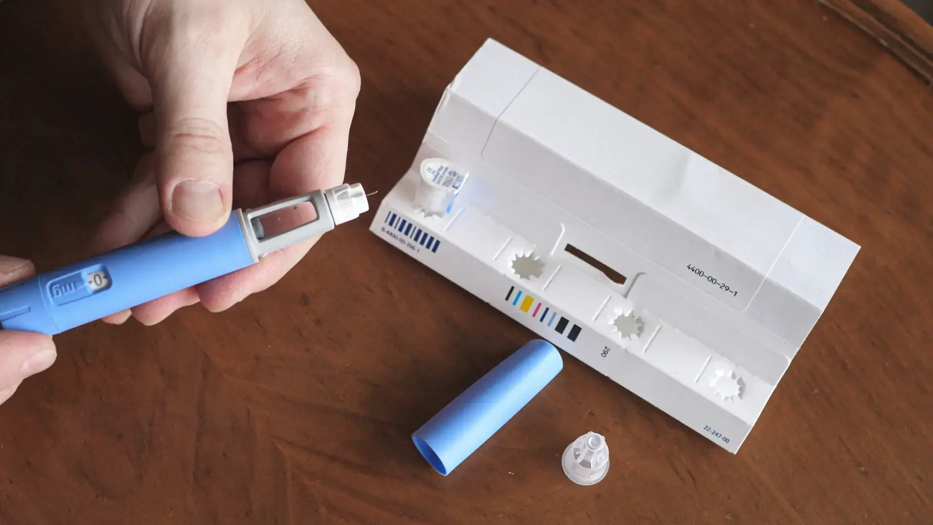 An individual preparing a Semaglutide injection.