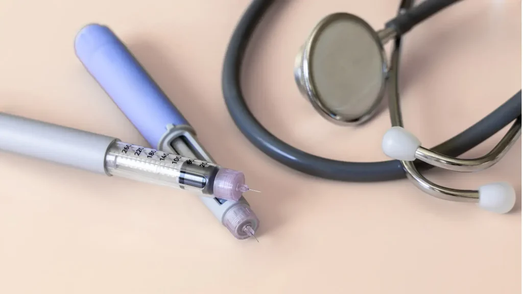 Injectable pens and a stethoscope.