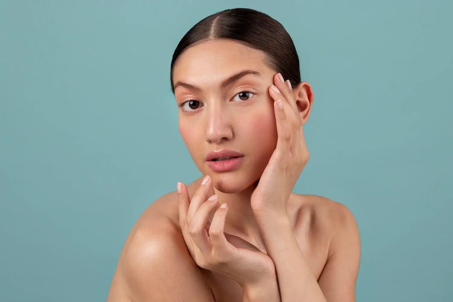 An individual flexing their smooth and firm skin.