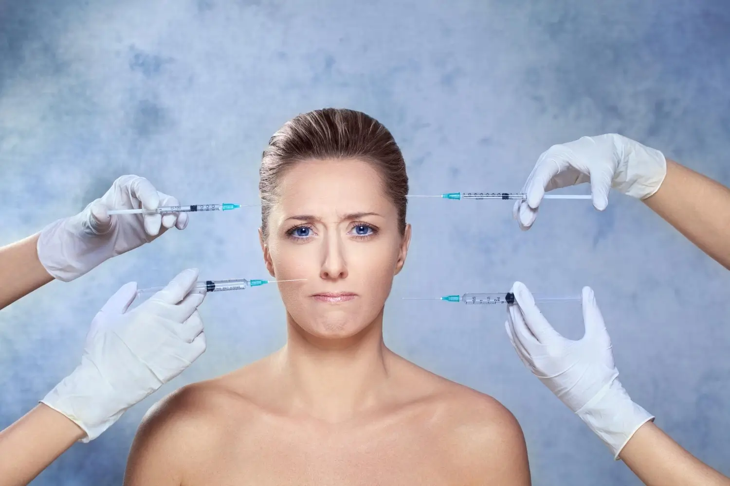 An individual receiving various injection into their facial region.