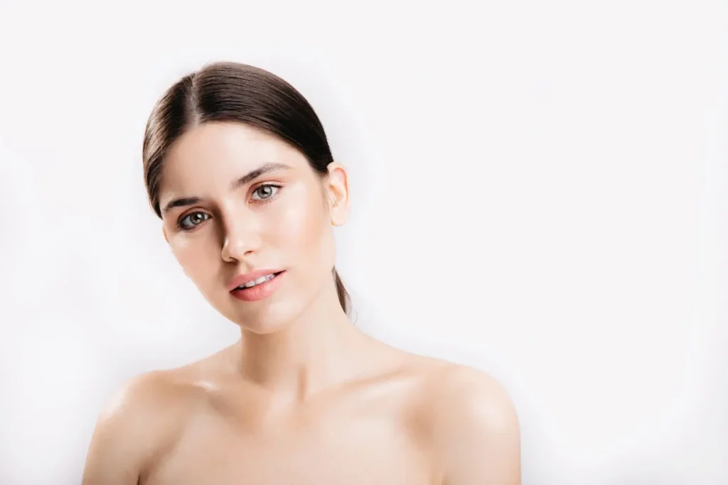 An individual having a smooth, clear facial skin.