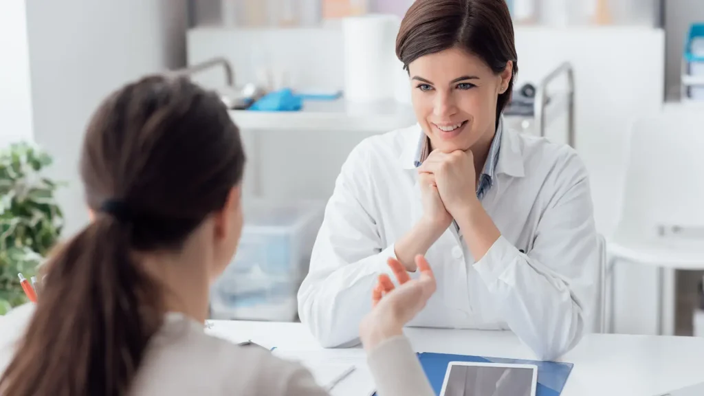A doctor and patient consultation regarding a treatment.