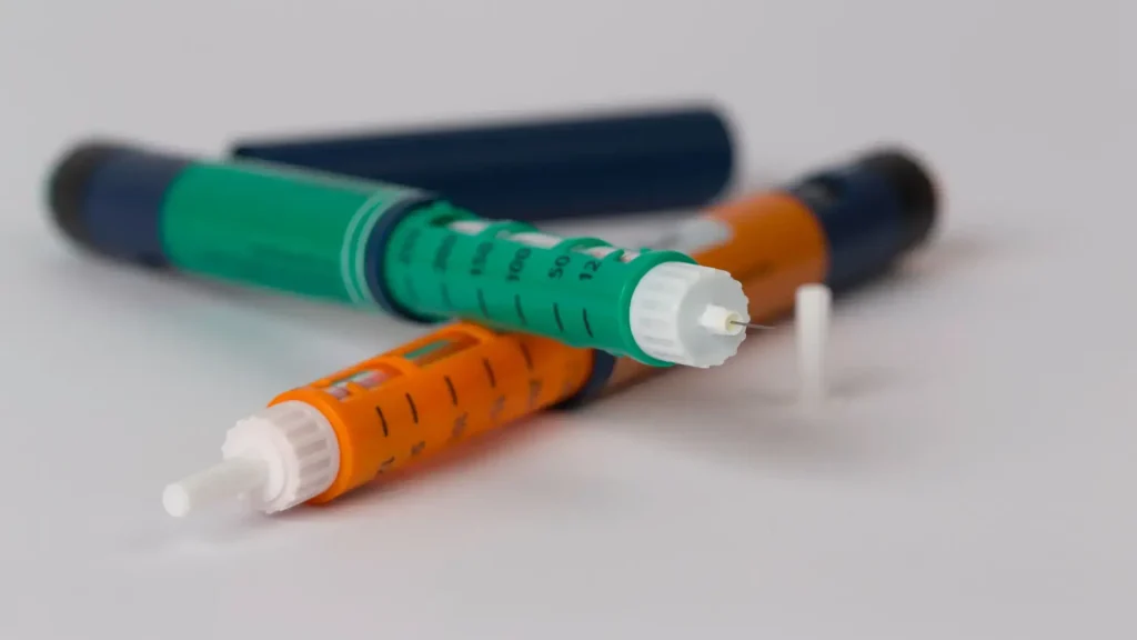 A close-up shot of two injectable pens.