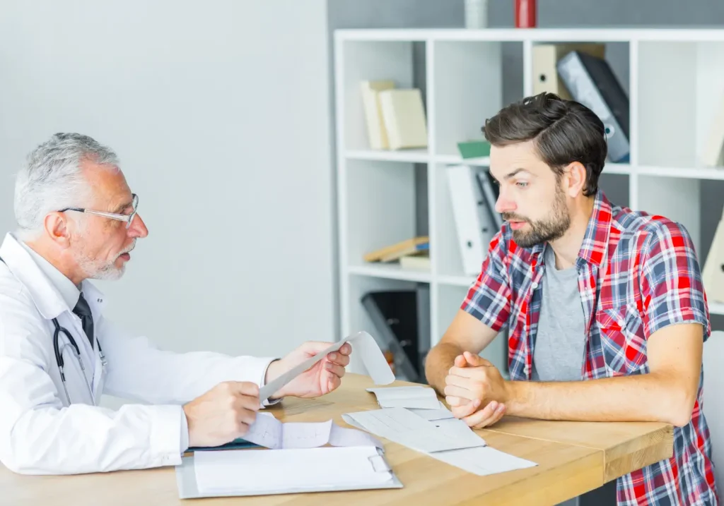 An individual consulting a medical professional.