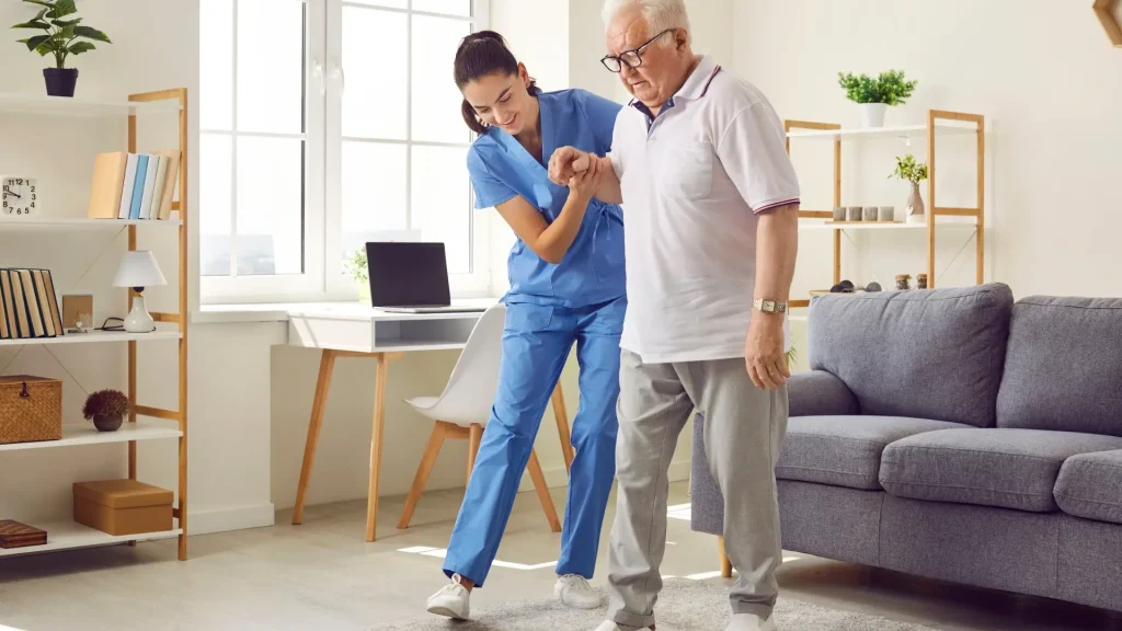 A healthcare provider assisting a patient during a physical therapy session.
