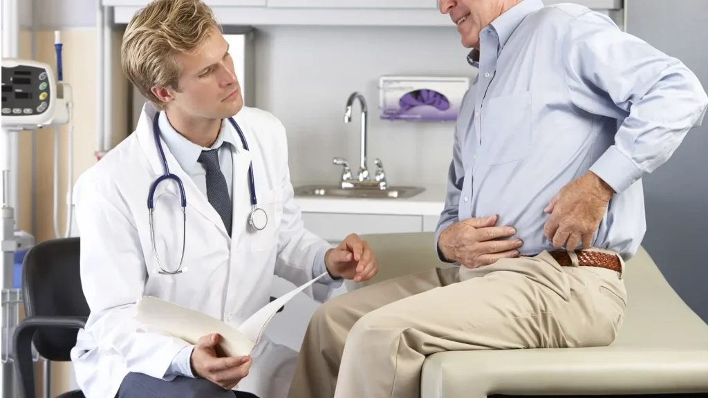 An older individual undergoing an assessment for their hip.