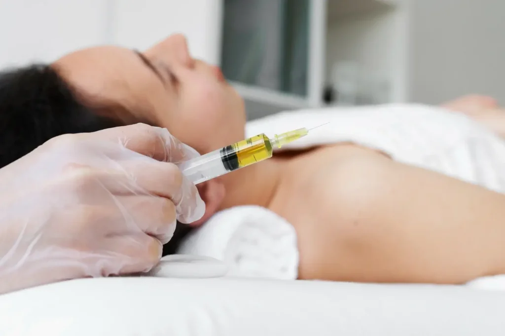 A close-up shot of the injection before the facial treatment.