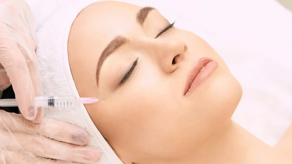 An individual receiving an injection for their crow's feet.