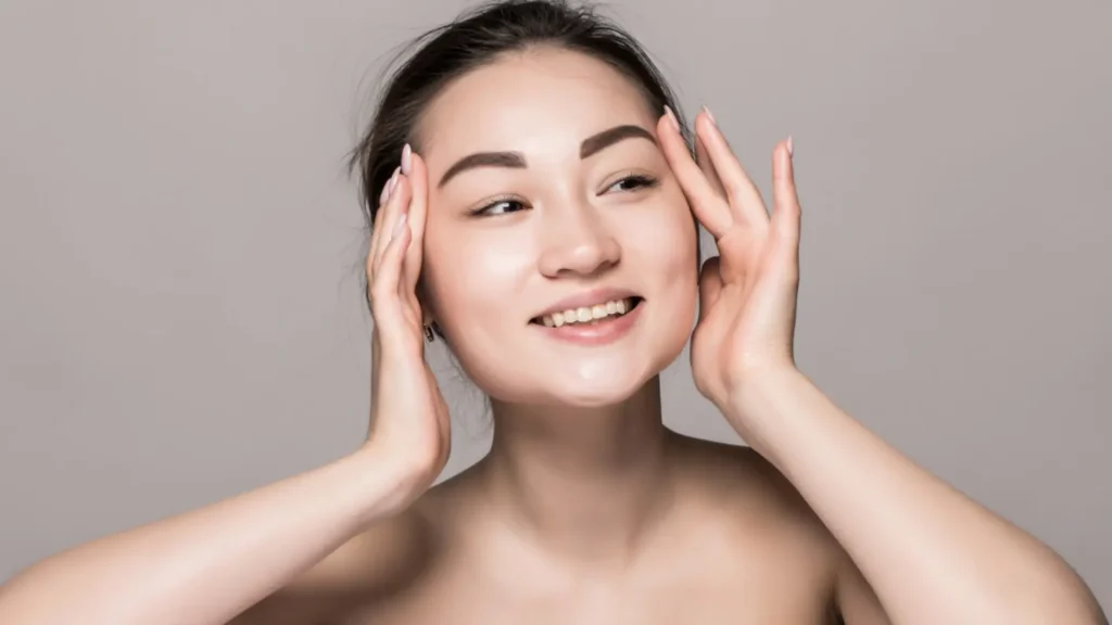 An individual flexing their smooth and clear skin.