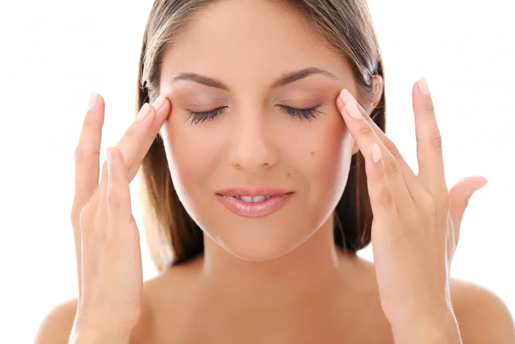 A woman looking happy with their fresher, youthful look with an improved under eye region.