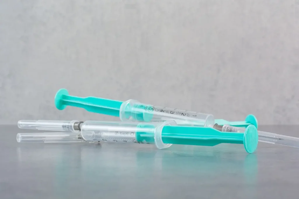 Syringes on a marble surface.