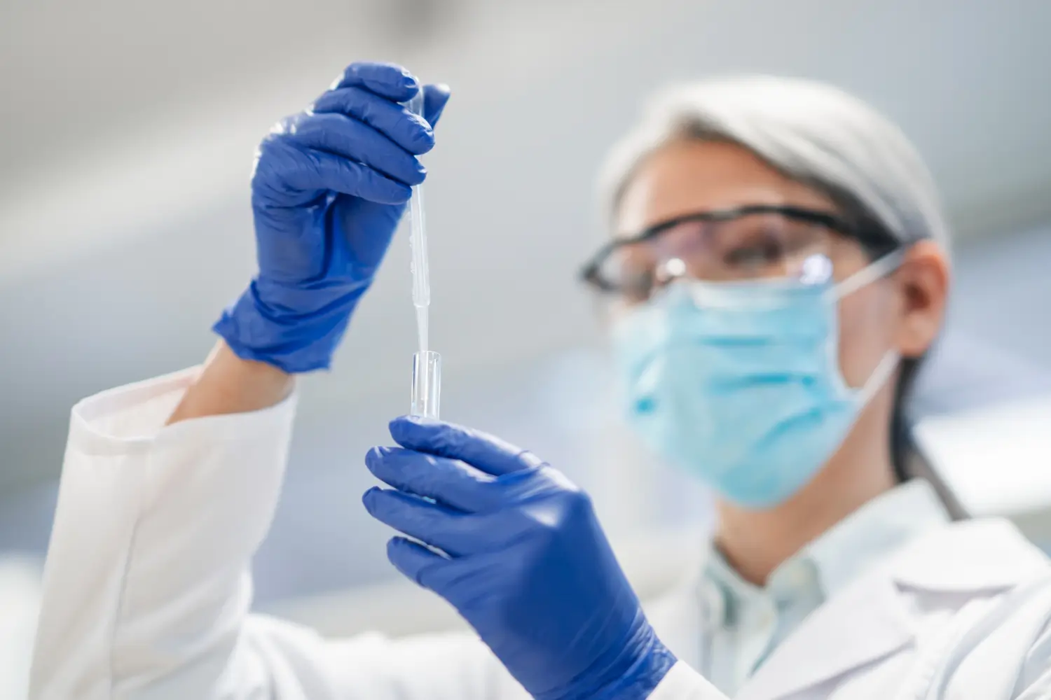 A medical expert assessing the formulation in a laboratory.