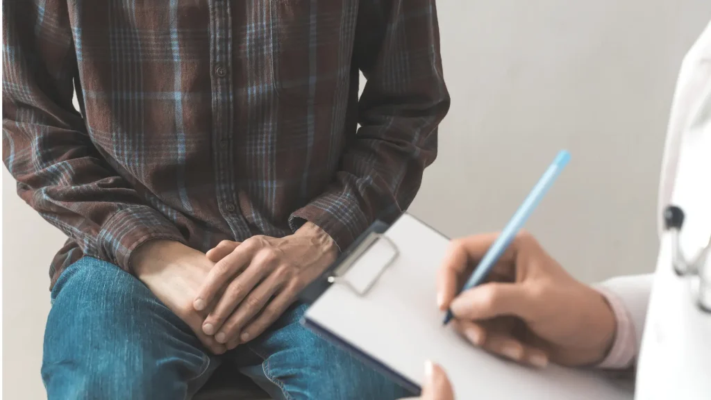 An individual undergoing a consultation for their private part with a medical professional.