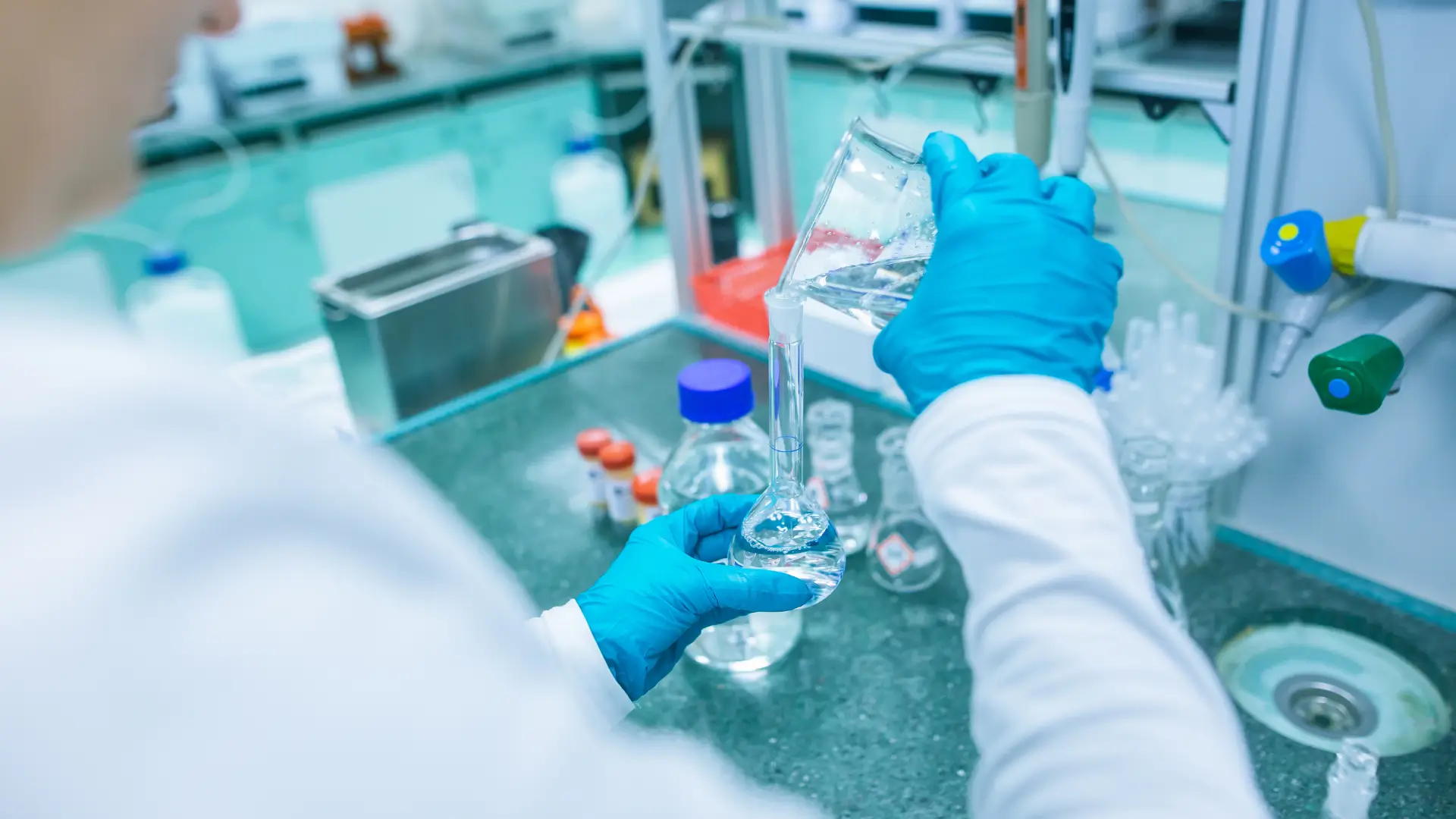 A medical expert working with formulations in a laboratory.
